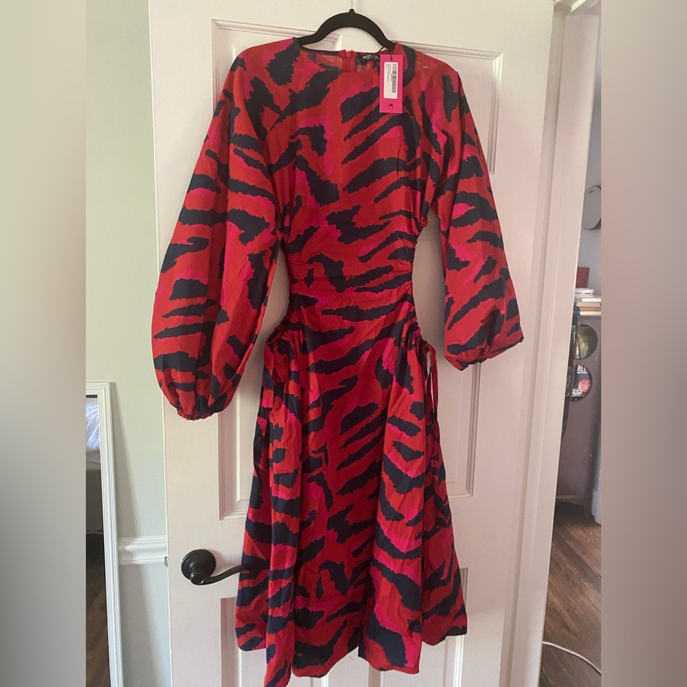 Zebra dress with side cut outs. Never worn.